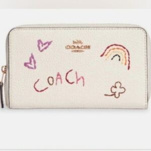 COACH Medium ID Zip Wallet
With Diary Embroidery in Gold/ Chalk